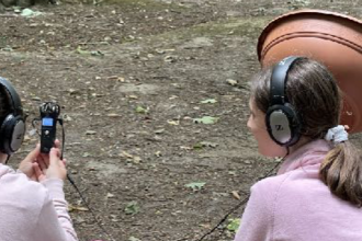 A parabolic "potabolic" microphone being used to record birdsong