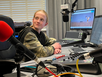 Youth Board member sat at recording desk of Hospital Radio Ipswich 