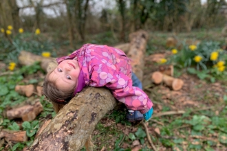 Child on log