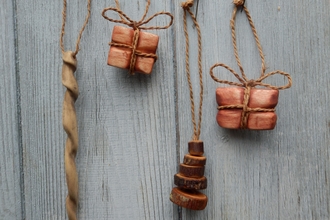 A selection of wooden Christmas decorations carved on one of Fay Jones workshops