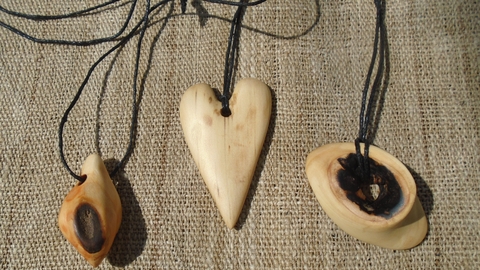 A selection of carved wooden pendants