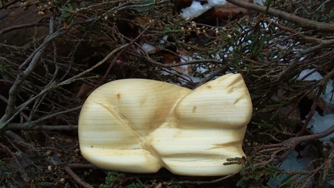 A small animal carved from wood