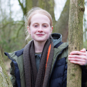 James, Youth Board member, standing by a tree, image credit Simply C Photography